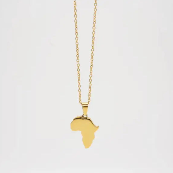 Gold necklace with a pendant shaped like the African continent on a white background