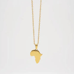 Gold necklace with a pendant shaped like the African continent on a white background