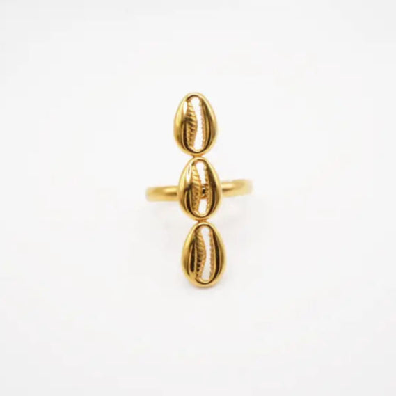 Gold ring with three vertical cowries and a unique design on a white background