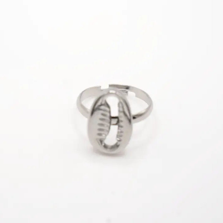 Silver ring with a cowrie on a white background