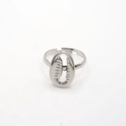 Silver ring with a cowrie on a white background