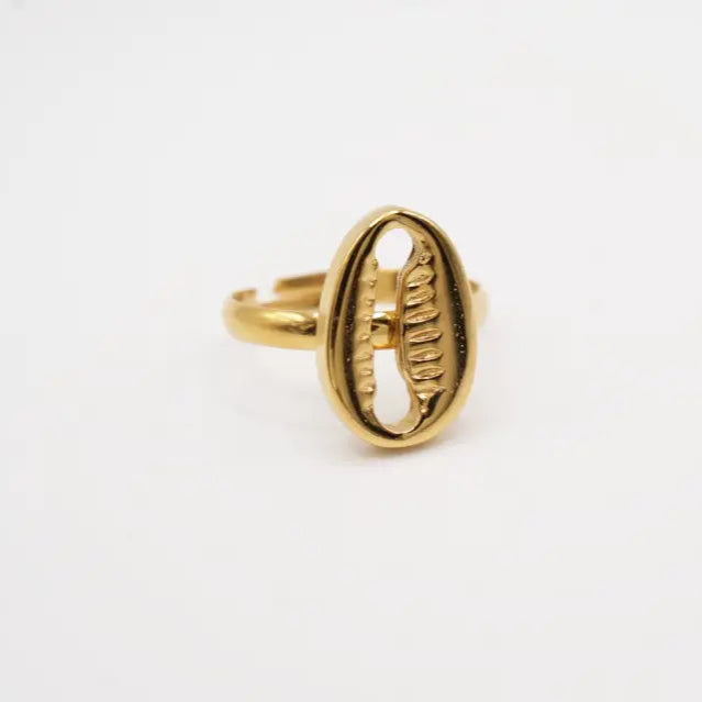 Gold plated cowry ring with a unique design on a white background