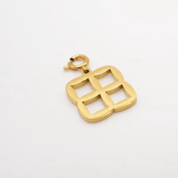 Gold pendant on a white background