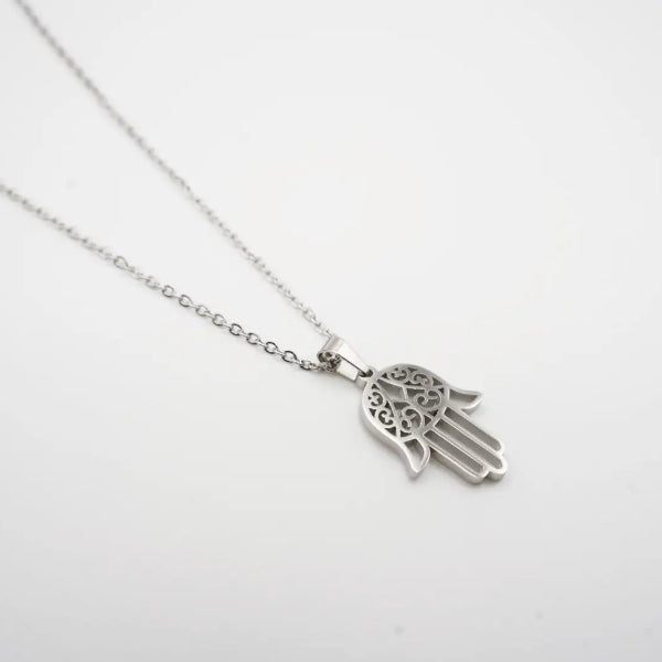 Silver Hamsa hand necklace on a white background