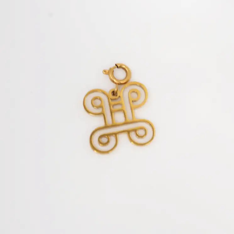 Gold pendant on a white background