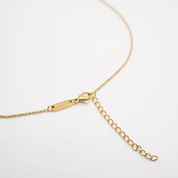 Gold chain necklace on a white background