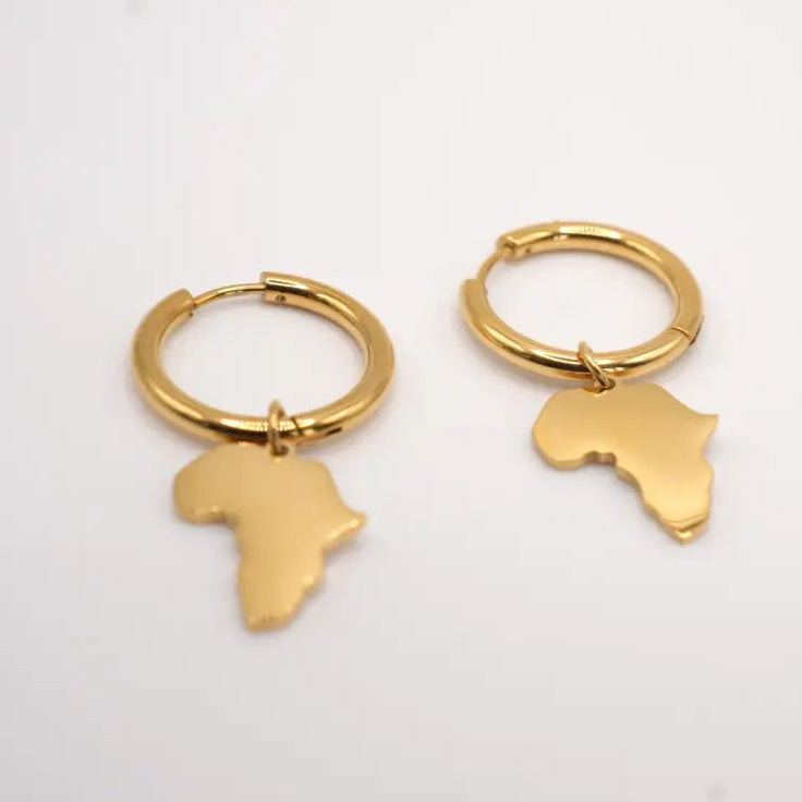 Gold hoop earrings with Africa-shaped charms on a light gray background