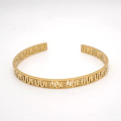 Gold bracelet  with adinkra symbols with a pattern on a white background
