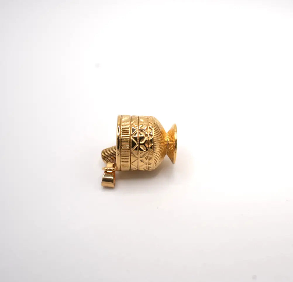Gold decorative object on a white background