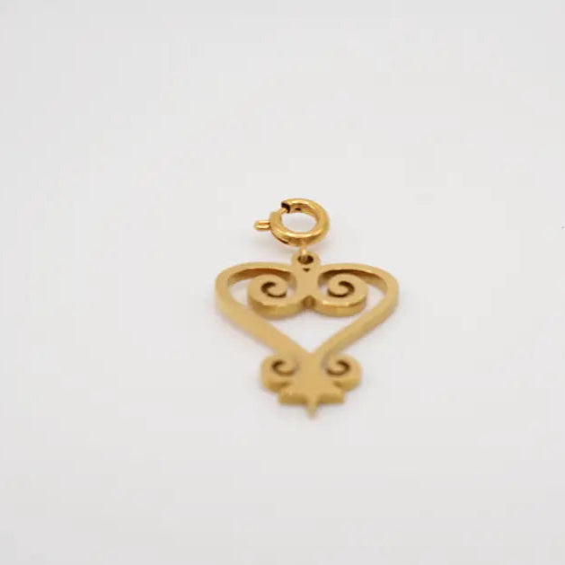 Sankofa Gold charm on a white background